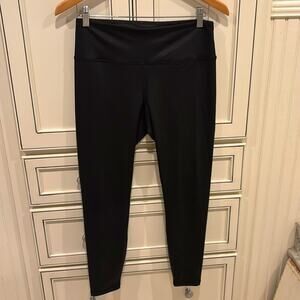 Black faux leather looking leggings, size L